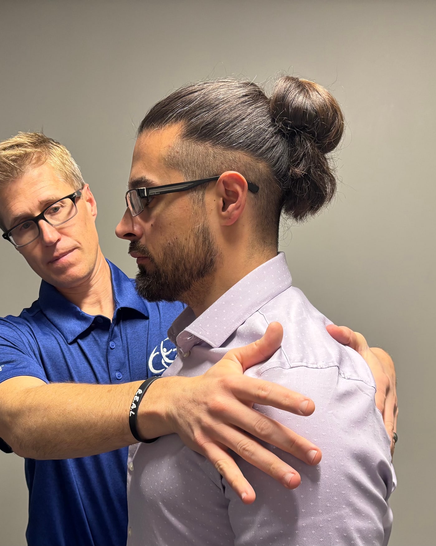 MCTA-accredited instructor demonstrating cervical Mobilization With Movement™ on a patient